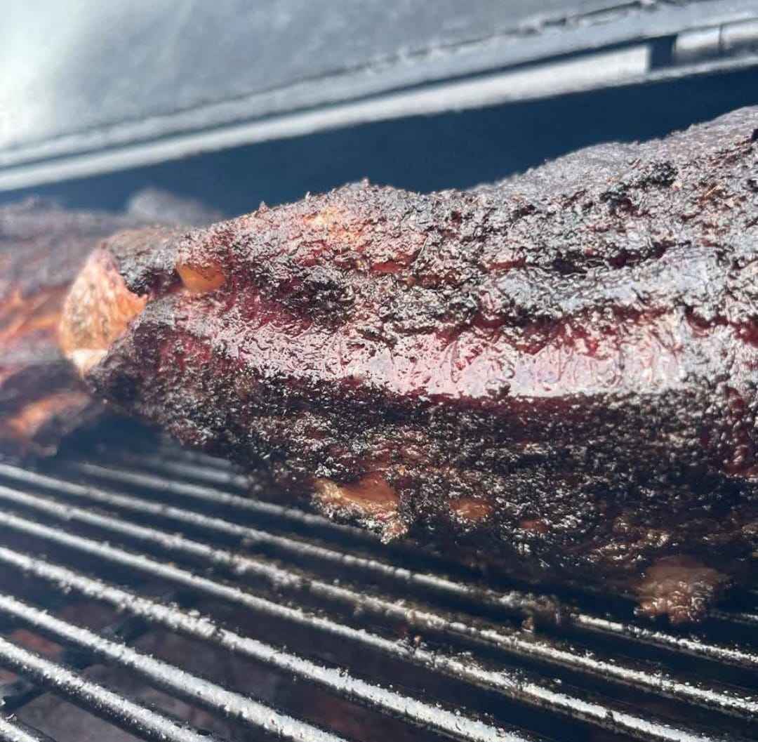 Pitmaster glazing ribs at Smoke Boys